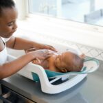 The First Years Sure Comfort 4-in-1 Reclining Baby Bathtub - Adjustable All-in-1 Bathtub for Newborn to Toddler - Baby Bath Seat Adjusts as Baby Grows - Ages 0 to 24 Months
