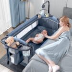 BabyBond Baby Bassinet Bedside Crib, Pack and Play, Diaper Changing Table | Portable Large Playard, Music Mobile, with Mattress, Lockable Wheels, Storage Shelf, Easy Fold, From...